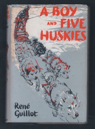 Item #20375 A Boy and Five Huskies. Rene Guillot